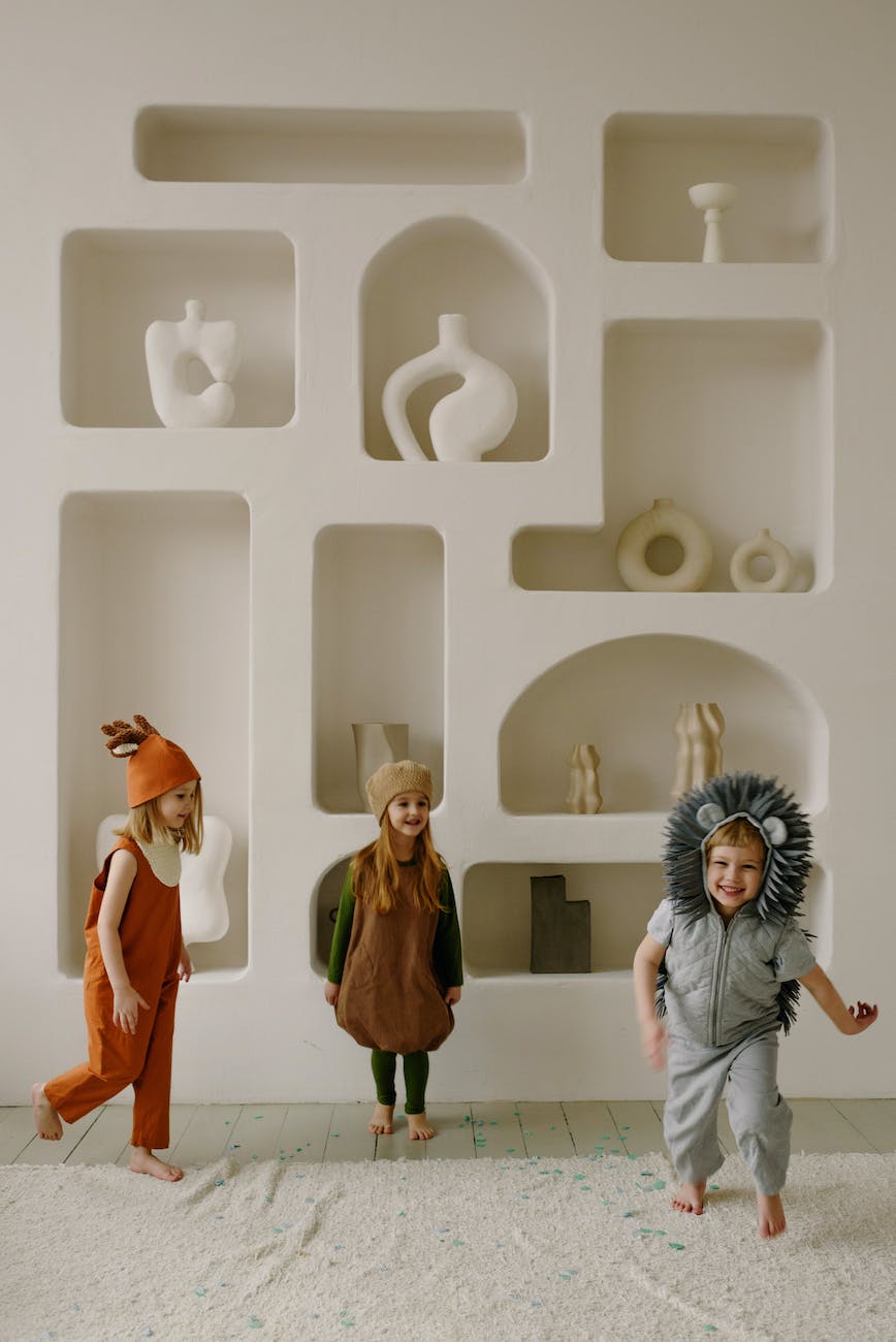 toddlers wearing costume playing together