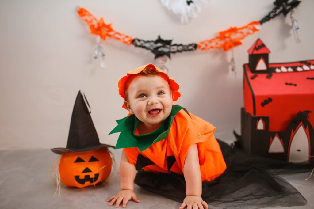 cute baby boy wearing pumpkin costume