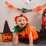 cute baby boy wearing pumpkin costume
